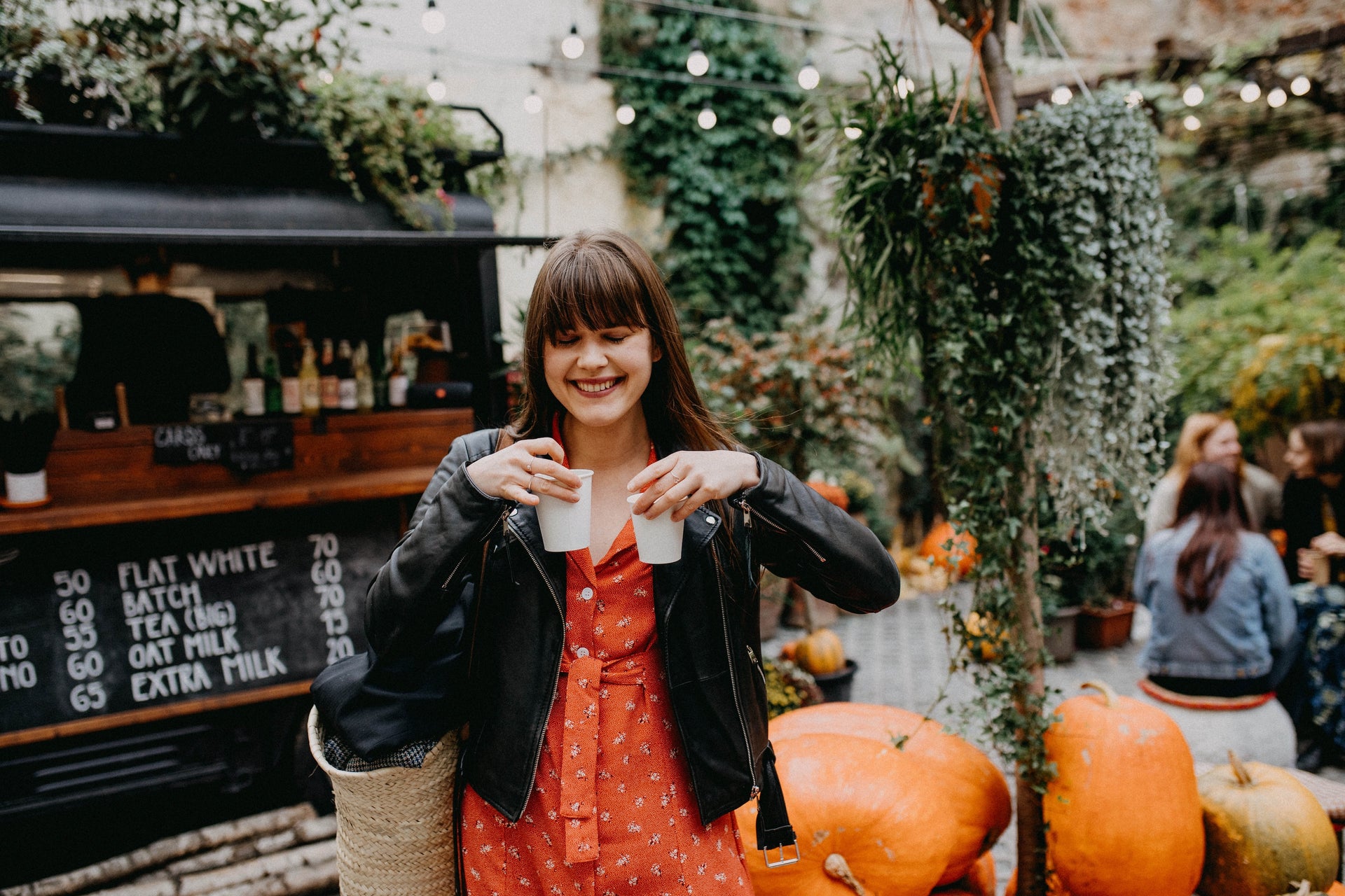 woman-buying-coffee-to-go-2021-09-02-07-10-24-utc - Unknown Entity Coffee